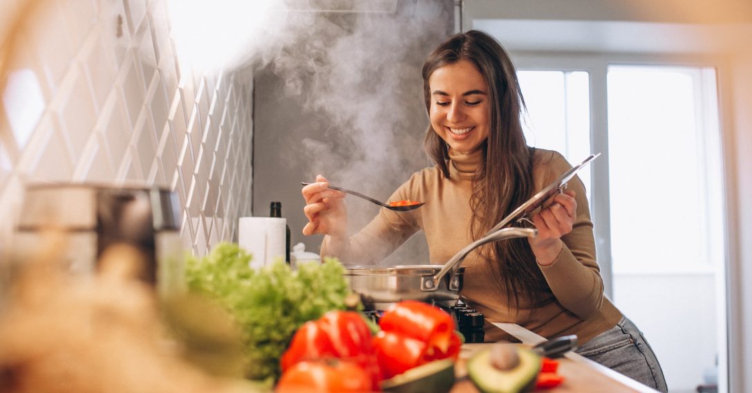 Woman cooking at kitchen