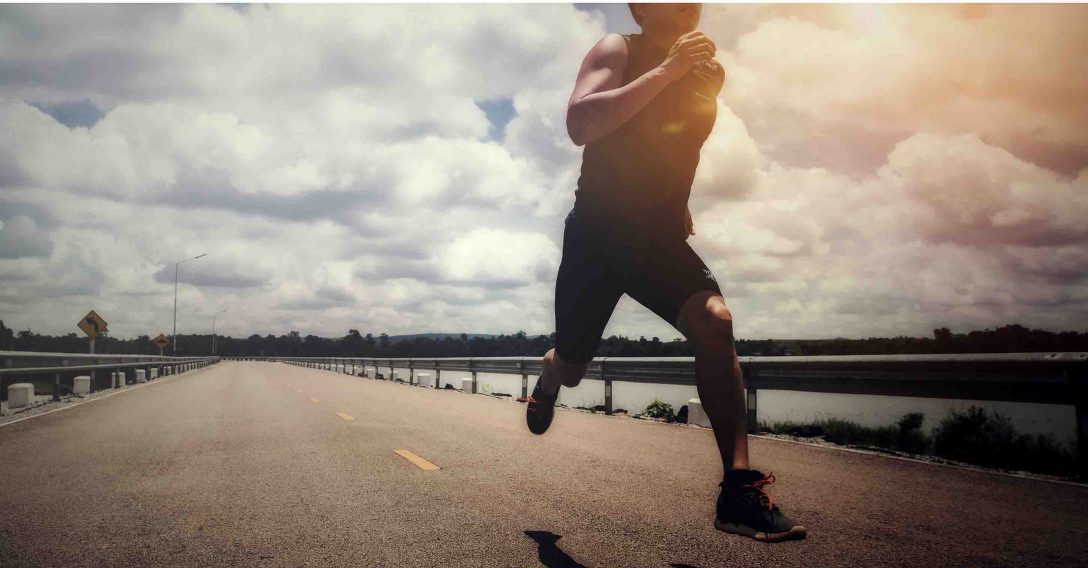 Sport man with runner on the street be running for exercise.